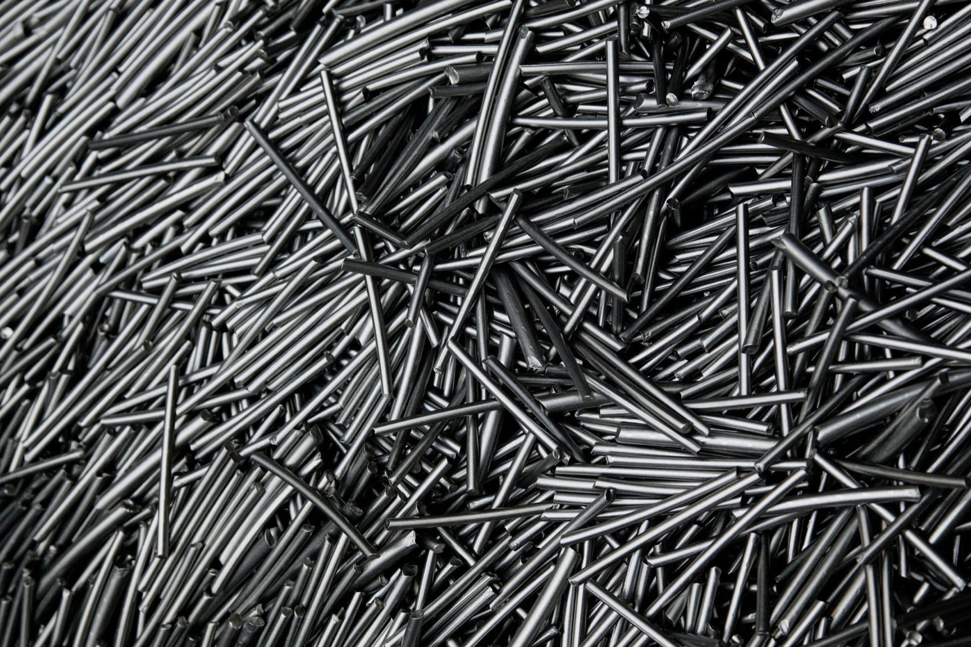 A pile of thousands of titanium rods at Perryman Company's facility