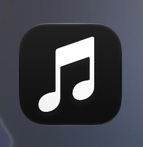 The new Apple Music app icon in iOS 27.2 beta 4, a white music note on a black background in Dark Mode