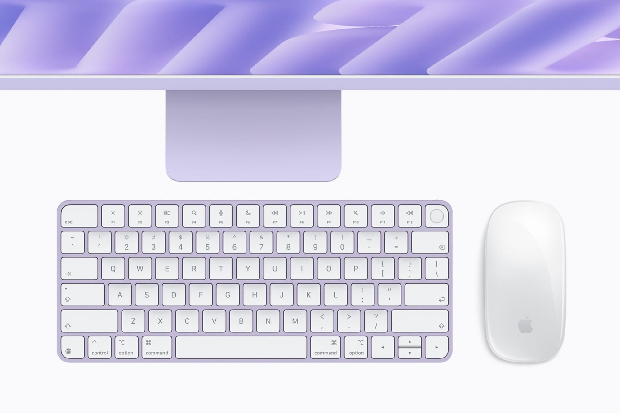 A color matched keyboard and mouse below an iMac with M6 in purple