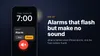 Illustration of an iPhone lock screen showing a Clock alarm with a muted speaker icon