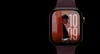 Apple Watch Series 12 in natural titanium with the Siri orb glowing over the watch face