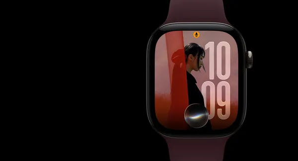 Apple Watch Series 12 in natural titanium with the Siri orb glowing over the watch face